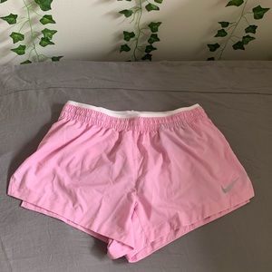 pink nike dry fit athletic shorts
